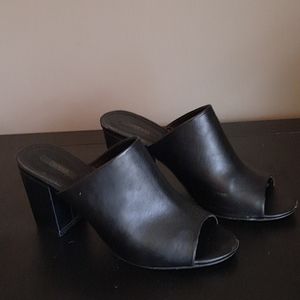 Black faux leather mules